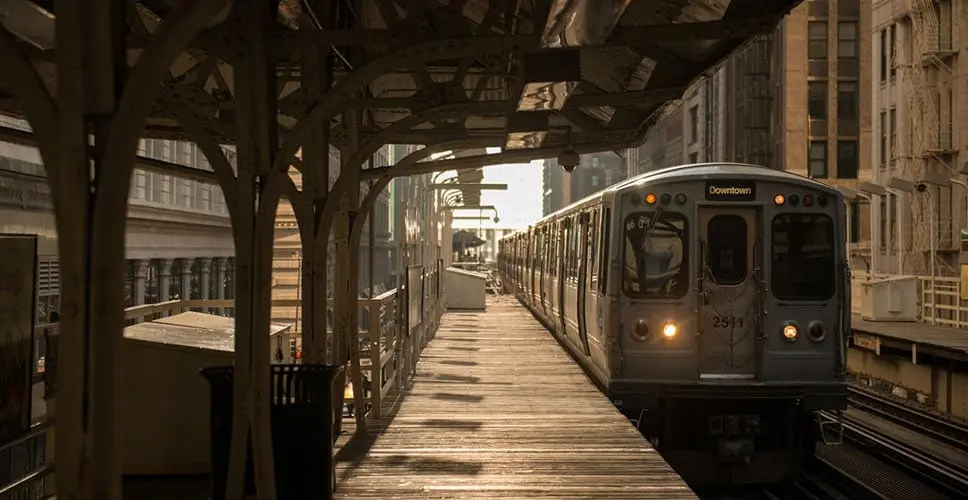 A view of a Chicago train stop at dusk.