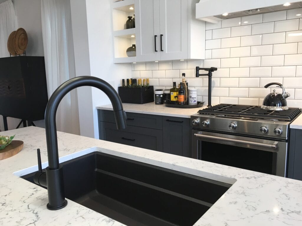 black kitchen sink with white countertop