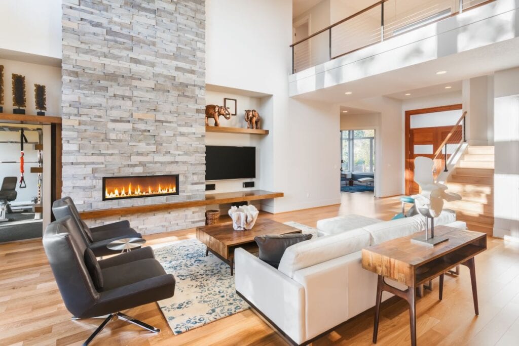 Gray stone fireplace in luxurious living room